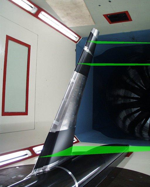 F11 model in wind tunnel, showing laser light sheets